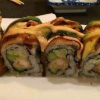 Danny Roll Jumbo Special Rolls · 8 pieces. Shrimp tempura, asparagus, cucumber inside and eel, avocado with spicy sauce on top.
