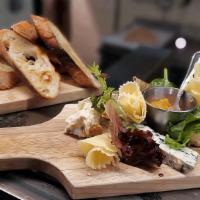 Cheese Plate · A variety of cheeses, including camembert, Gouda, herb goat cheese,, 24-month aged comte, Br...