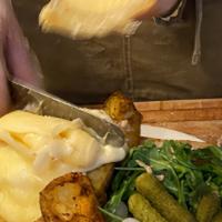 Raclette Suisse · Roasted new potatoes, cornichons, pickled white pearl onions with a choice of charcuterie