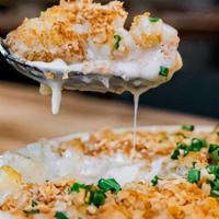 Mornay Mac N Cheese · Ditalini pasta, baked with Raclette's signature mornay sauce, with gruyere, cheddar, and par...
