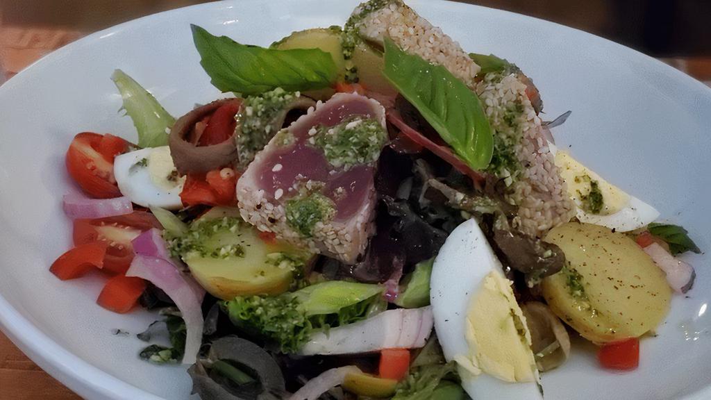 Salad Nicoise · Mesclun, green beans, grape tomatoes, red onions, tuna, hard-boiled egg, anchovies, red wine vinaigrette
