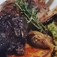 Rack Of Lamb · Roasted rack of lamb with polenta and potatoes au gratin. Tableside scrape of raclette chees...
