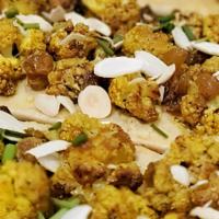 Cauliflower (Vegan) · Curry-roasted cauliflower, house-made hummus, golden raisins, toasted almonds, on toasted, n...