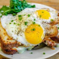 Croque Madame · Jambon de Paris, gruyere on toasted brioche, topped with mornay sauce and two fried eggs