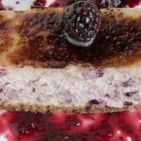 Blackberry Thyme Cheesecake · Lemon Curd, bruleed sugar, fresh blackberries, raspberry puree