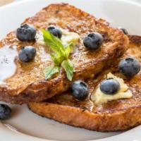 Blueberry French Toast A La Carte · Sliced challah bread soaked in eggs and milk, then fried and topped with blueberries served ...