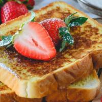 Strawberry French Toast A La Carte · Sliced challah bread soaked in eggs and milk, then fried and topped with strawberries served...