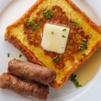 Sausage French Toast · Sliced challah bread soaked in eggs and milk, then fried and topped with savory pork sausage...