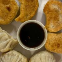 Pork  Dumplings (7Pcs) - Fried · Homemade Style. 7 Pieces. Served Dipping Dumplings Sauce on the side.