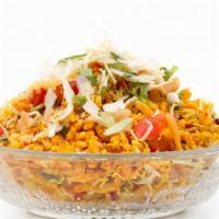 Bhel · Mix of rice puffs and savories, topped with spicy cilantro and mint chutney