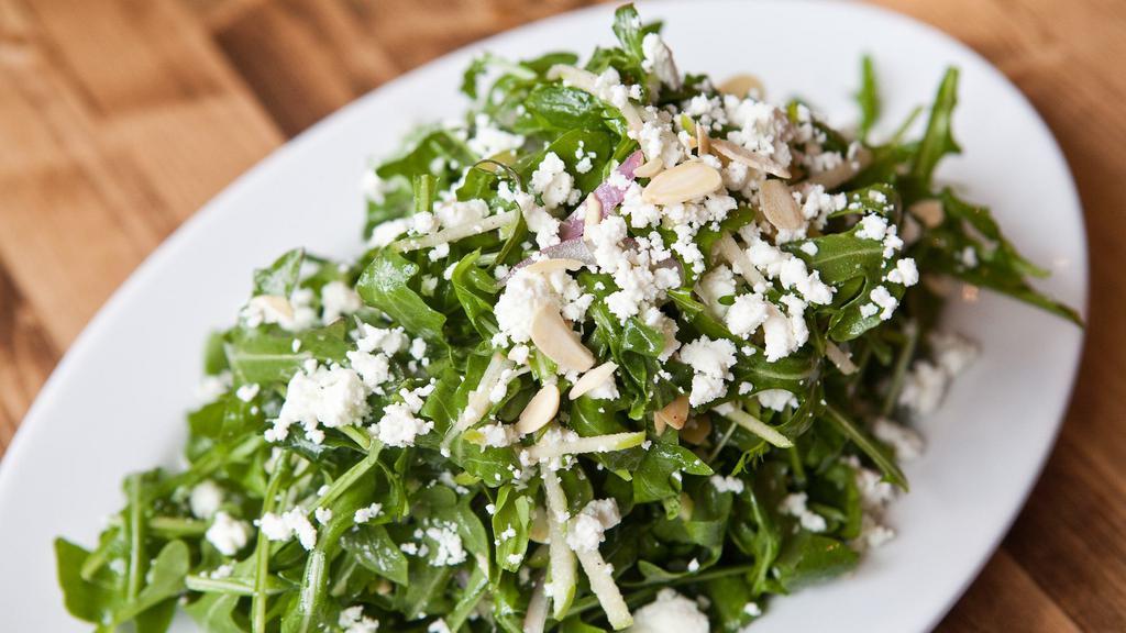 Baby Arugula · Granny Smith apple, toasted almonds, red onion, goat cheese and roasted lemon vinaigrette.