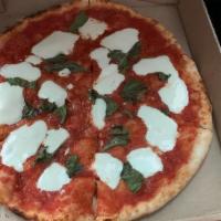 Margherita Pizza · Tomato sauce, fresh mozzarella, basil, Pecorino and extra virgin olive oil.