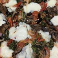The Veggie Pizza · Smoked mozzarella, broccoli rabe, roasted red peppers, seared oyster mushrooms, cherry tomat...