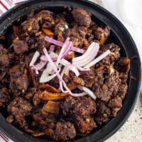 Beef Fry · Stir fried sab beef with sliced coconut and onions.