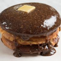 Sunday Pancakes - Double · A Double Stack of our Sunday Pancakes with Maple Hazelnut Praline and a pat of Brown Butter