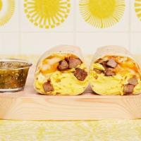 Steak Breakfast Burrito · Two scrambled eggs, hash browns, grilled steak, and melted cheese wrapped in a fresh flour t...