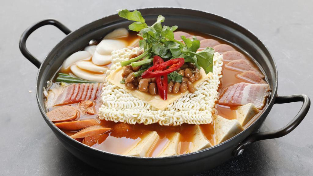 Budae Jjigae/Army Stew 부대찌개 · The most popular stew with spam, sausage, bacon, kimchi, and ramen noodle.