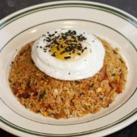 Kimchi Fried Rice / 김치 볶음밥 · Stir fried chopped kimchi 
Served with sunny-side up egg fry.
Available to add spam or bacon.