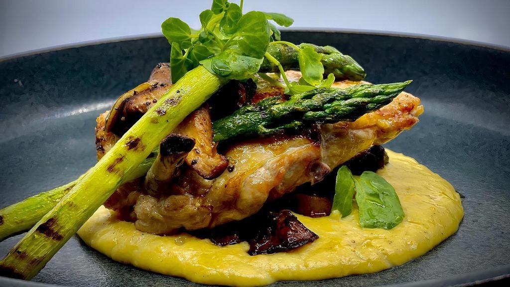 Taboon Baked Lemon Herb Chicken Polenta · Served over corn polenta and truffle oil and a selection of sautéed wild mushrooms. GF.