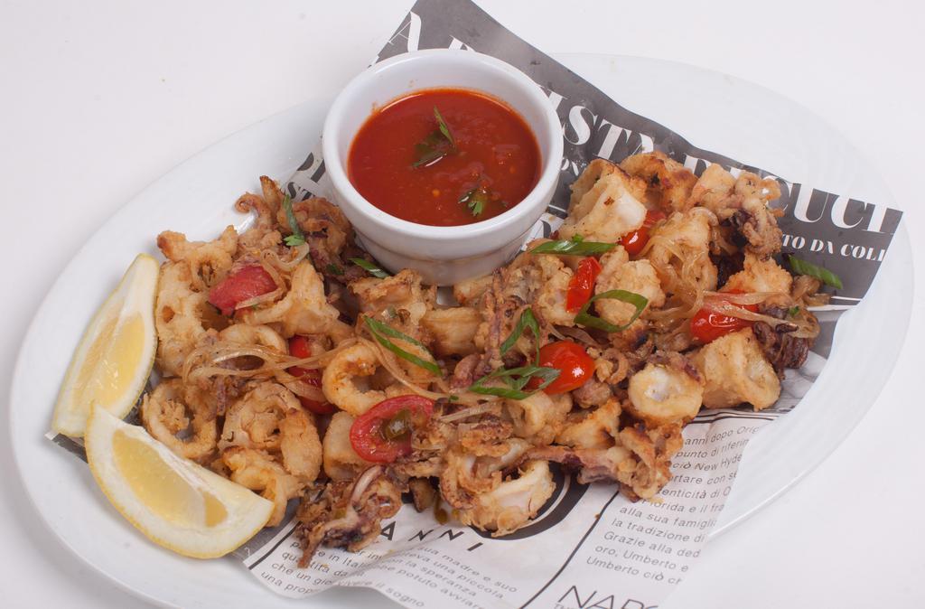 Calamari Alla Umberto · Crispy fried calamari sautéed in onions, garlic, cherry peppers and sweet cherry tomatoes.