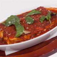 Lasagna · Made with ricotta, homemade mozzarella, meatballs, and sausage in our famous tomato sauce.