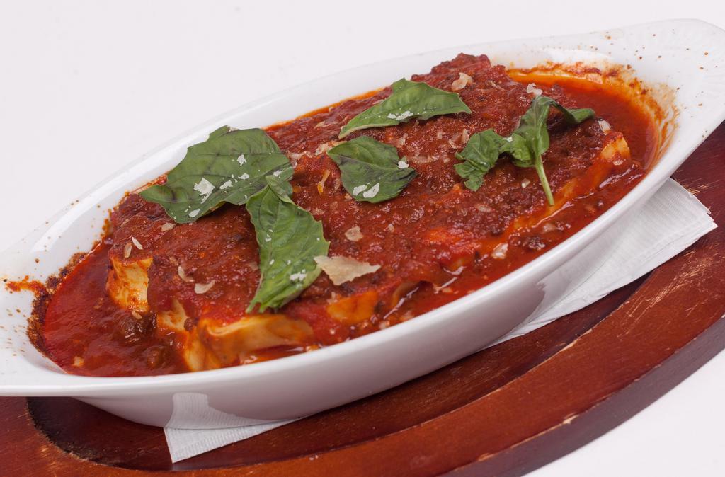 Lasagna · Made with ricotta, homemade mozzarella, meatballs, and sausage in our famous tomato sauce.
