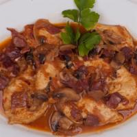 Chicken Marsala · Our famous brown sauce with mushrooms, prosciutto, onions and marsala wine.