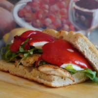 Grilled Chicken Arugula, Fresh Mozzarella, Roasted Peppers · Grilled chicken breast, arugula, mozzarella, roasted red peppers, and balsamic vinaigrette