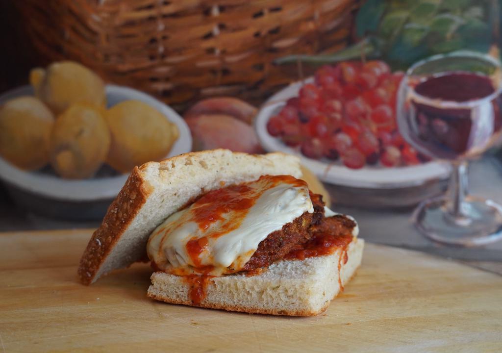Chicken Parmigiana · Chicken cutlet topped with marinara and melted mozzarella.
