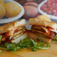 Eggplant Parmigiana · Fried eggplant topped with marinara sauce and melted mozzarella.