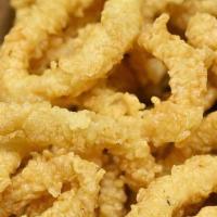 Fried Calamari · Squid rings  coated in seasoned flour and deep fried to golden brown perfection. Served with...