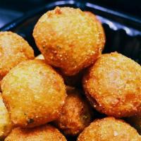 Hush Puppies (10) · A small, savoury, deep-fried round ball made from cornmeal-based batter.Served with ketcup.