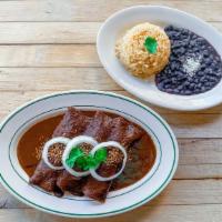 Mole Poblano Enchiladas · 3 corn tortillas filled with choice of filling, topped with spicy & sweet mole poblano sauce...