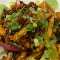 Duck Salad · Apple, cashew nut, lime juice, mango, mint, red onion and scallion. Spicy.