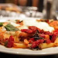 Rigatoni Di Spago · Chicken with garlic, fresh mozzarella, spinach and sun-dried tomatoes