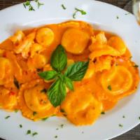 Lobster Ravioli · Served in  a brandy cream sauce with jumbo shrimp and scallops