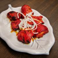 Chicken Tikka Boneless · Six pieces of boneless chicken pieces marinated with yogurt, spiced and broiled in an oven.