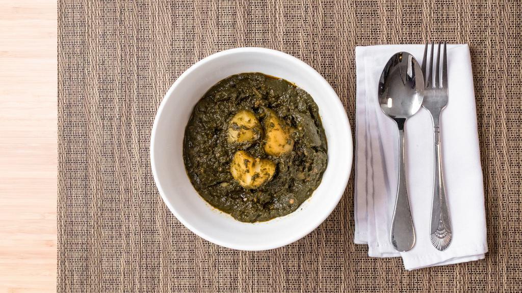 Palak Paneer · Spinach with fried cottage cheese, and fresh herbs.