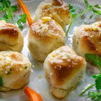 Garlic Knots (3) · Rolled baked garlic bread.