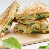 Grilled Cheese Pesto · Savory house-made pesto and Creamy cheese melted between buttery toasted bread.
