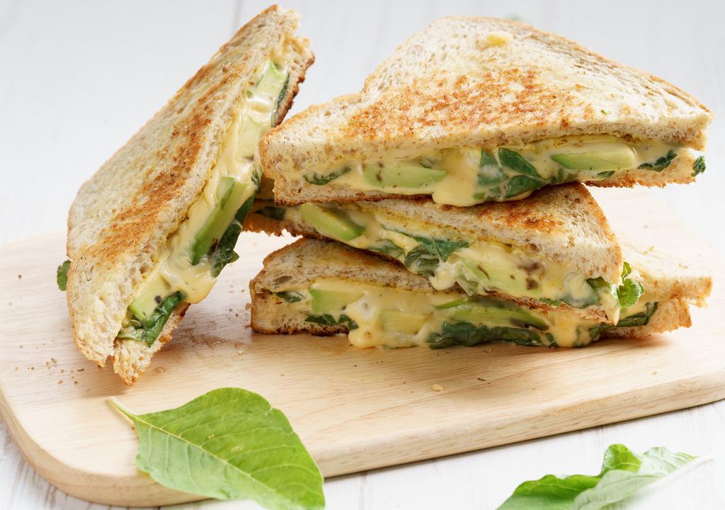 Grilled Cheese Pesto · Savory house-made pesto and Creamy cheese melted between buttery toasted bread.