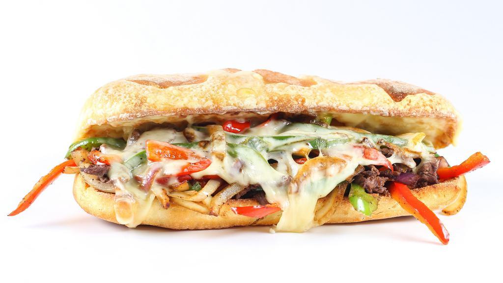 Philly Cheese Steak Deluxe · Juicy thinly sliced beef steak, onions, green peppers, and creamy cheese served between a buttery toasted hero with a side of fries and a drink.