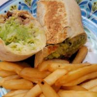 Chicken Chimichanga · Deep-fried burrito served on a flour tortilla stuffed with white rice, beans, cheese, lettuc...