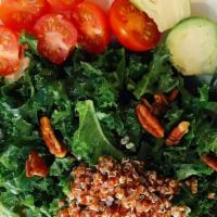 Buddha Bowl · Quinoa, kale, arugula, avocado, carrot, walnuts, tomato, cranberry, and sweet potato.