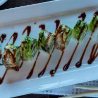Kumo Roll · Shrimp tempura, cucumber inside, topped with eel avocado, and eel sauce.