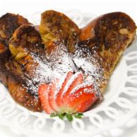 French Toast · Challah French toast served with powdered sugar and syrup on side.