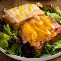 Monte Cristo Sandwich · Virginia ham, turkey & melted Swiss cheese.