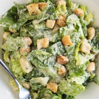 Caesar Salad · Hearts of romaine, croutons, and Parmesan cheese served with a creamy Caesar dressing.