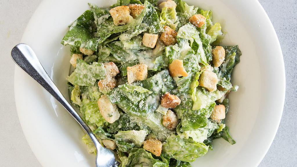 Caesar Salad · Hearts of romaine, croutons, and Parmesan cheese served with a creamy Caesar dressing.