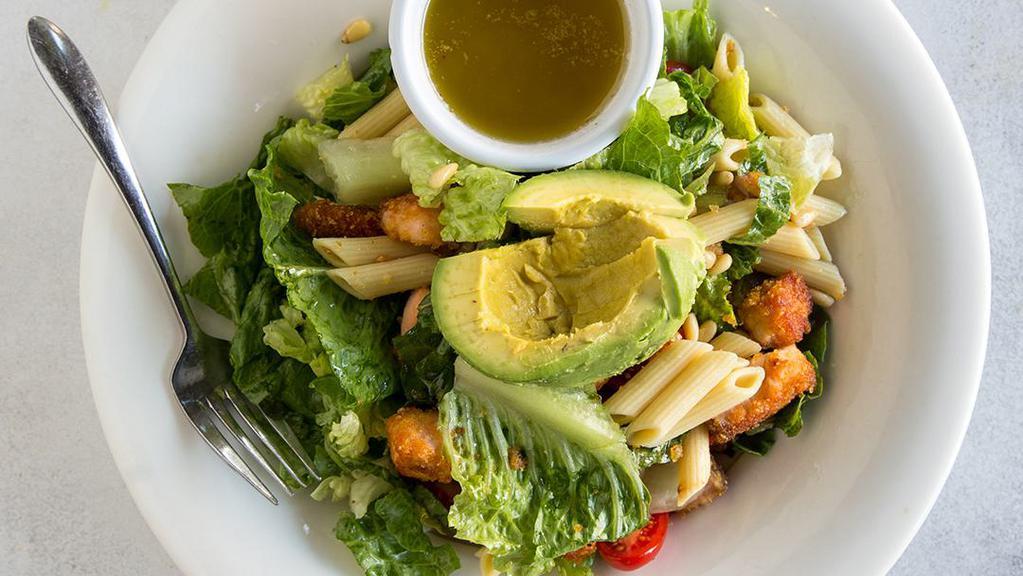 Pasta Salmon Salad · Cherry tomatoes, avocado, pine nuts, penne, romaine and salmon served with a lemon, and olive oil dressing.
